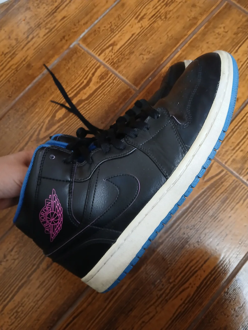 Classic Air Jordan high tops. Black with pink wing logo and blue